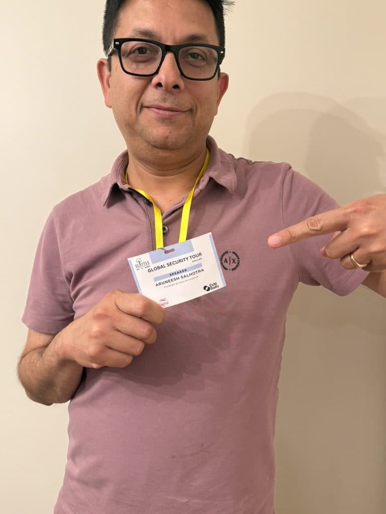 Aruneesh Salhotra holding his speaker badge at the Global Security Tour