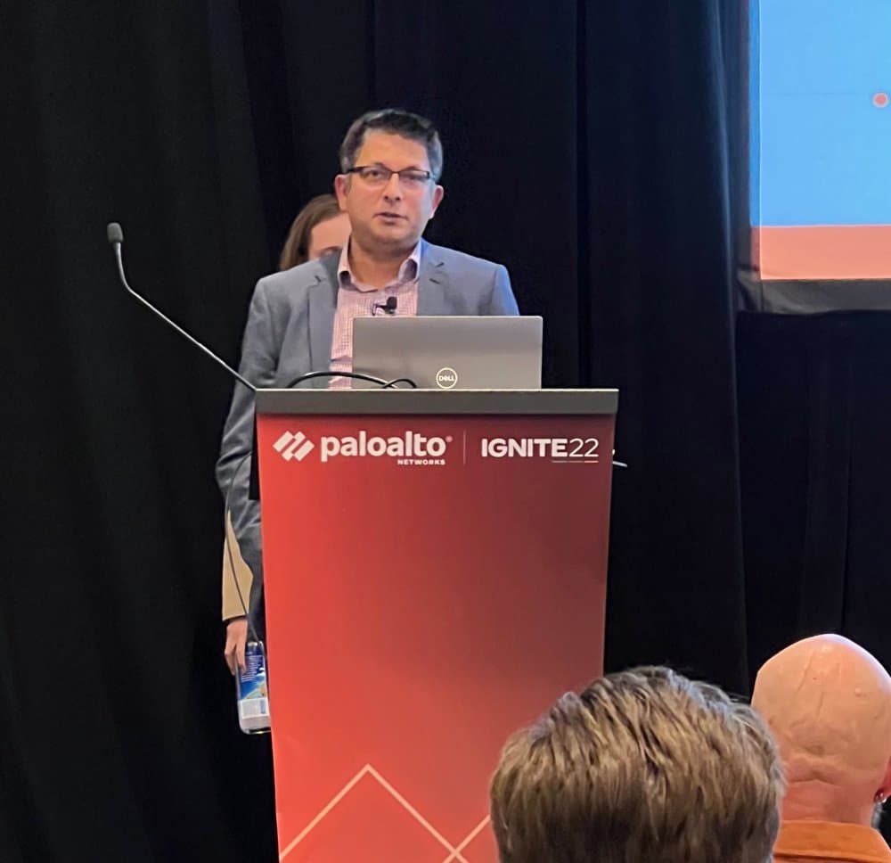 Aruneesh Salhotra speaking at the Palo Alto Networks Ignite '22 podium